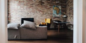 contemporary brick walled room with funky furniture in